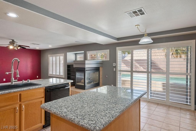 506 Staghorn Pass Ave, Las Vegas, NV 89183 - kitchen featuring a sink, black dishwasher, light tile patterned floors, ceiling fan, and a center island