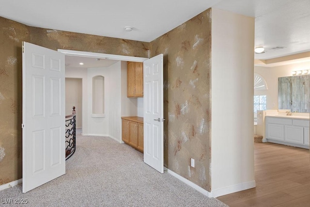 506 Staghorn Pass Ave, Las Vegas, NV 89183 - corridor featuring baseboards and a sink