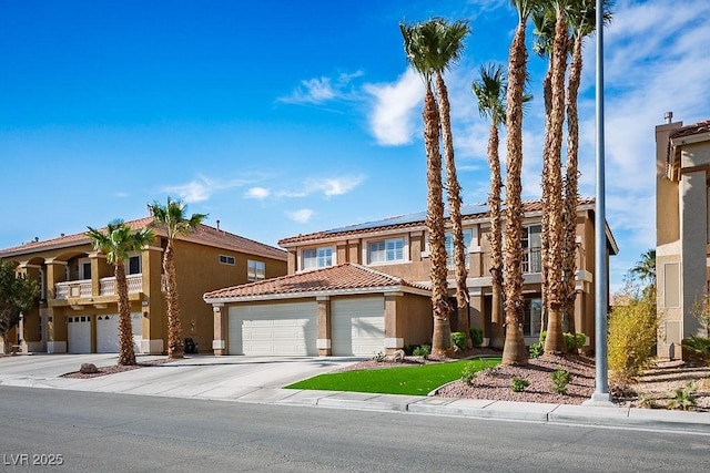 506 Staghorn Pass Ave, Las Vegas, NV 89183 - view of front of property with driveway, stucco siding, roof mounted solar panels, and an attached garage
