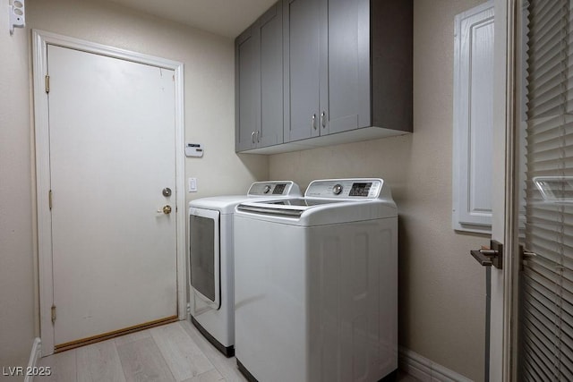 506 Staghorn Pass Ave, Las Vegas, NV 89183 - laundry room with separate washer and dryer, cabinet space, light wood-style floors, and baseboards