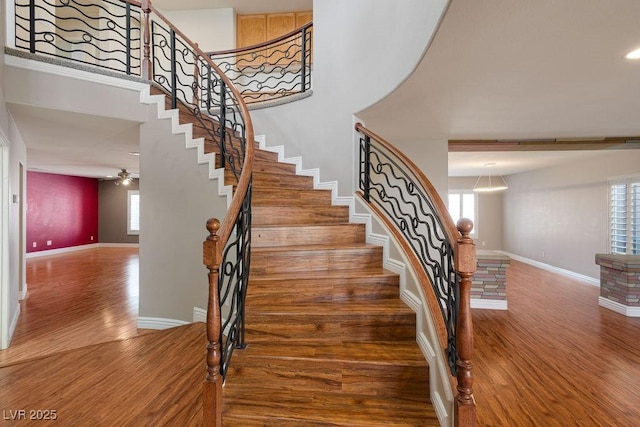 506 Staghorn Pass Ave, Las Vegas, NV 89183 - stairs with wood finished floors, baseboards, and ceiling fan