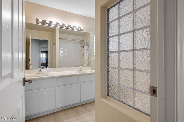 506 Staghorn Pass Ave, Las Vegas, NV 89183 - full bathroom featuring double vanity and a shower with shower curtain