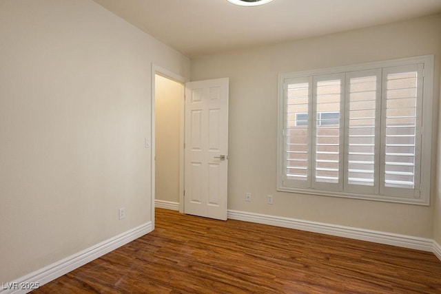 506 Staghorn Pass Ave, Las Vegas, NV 89183 - empty room featuring wood finished floors and baseboards
