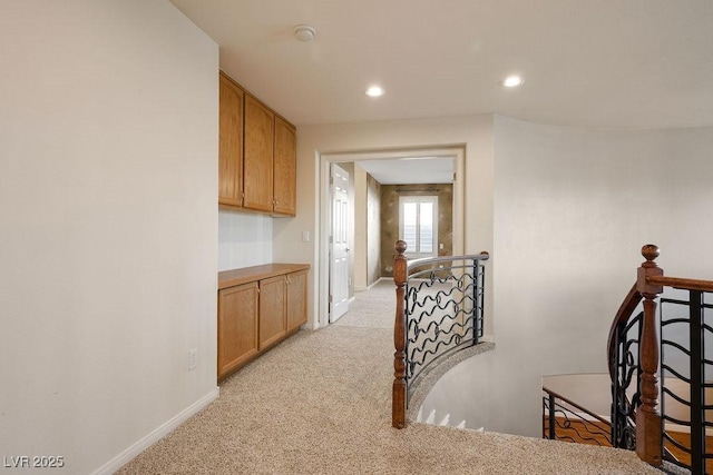 506 Staghorn Pass Ave, Las Vegas, NV 89183 - hallway with an upstairs landing, light colored carpet, baseboards, and recessed lighting
