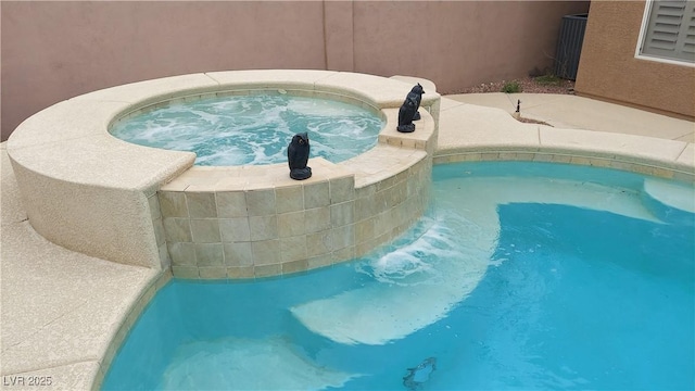 506 Staghorn Pass Ave, Las Vegas, NV 89183 - view of pool featuring an in-ground hot tub, central AC, and a swimming pool
