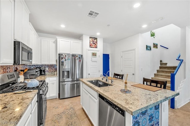 7364 N Decatur Blvd Unit 4, Las Vegas, NV 89131 - kitchen featuring stainless steel appliances, a sink, an island with sink, white cabinets, and recessed lighting