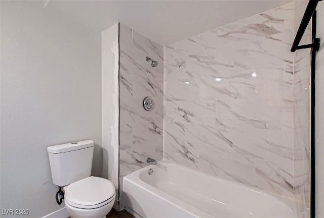 bathroom featuring  shower combination and toilet