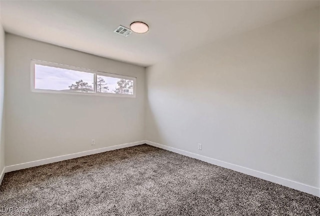 empty room featuring carpet, baseboards, and visible vents