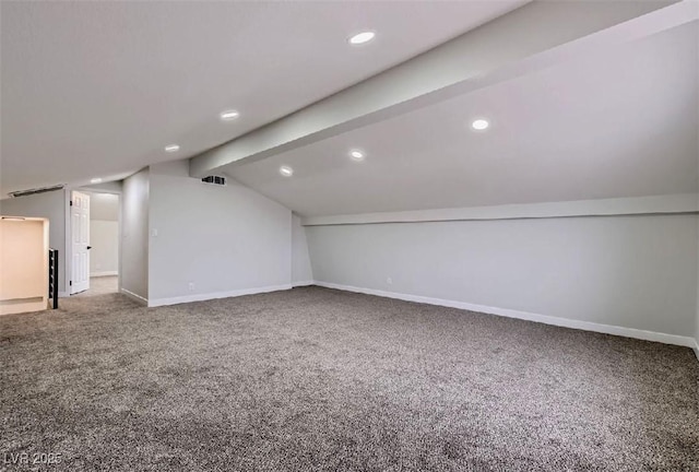 bonus room with carpet flooring, lofted ceiling with beams, baseboards, and visible vents