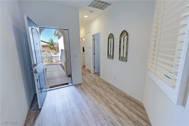 foyer entrance with baseboards, visible vents, recessed lighting, and light wood-type flooring