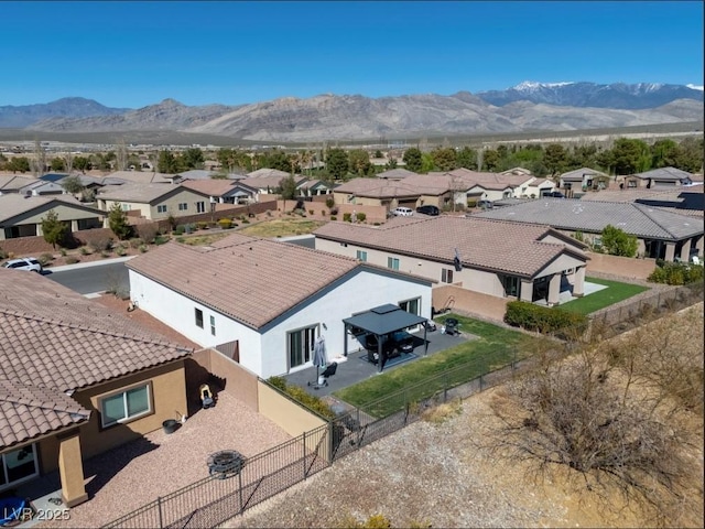 birds eye view of property with a residential view and a mountain view