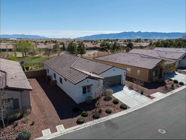 birds eye view of property featuring a residential view and a mountain view