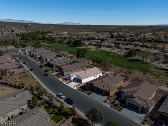 bird's eye view featuring a mountain view, view of golf course, and a residential view