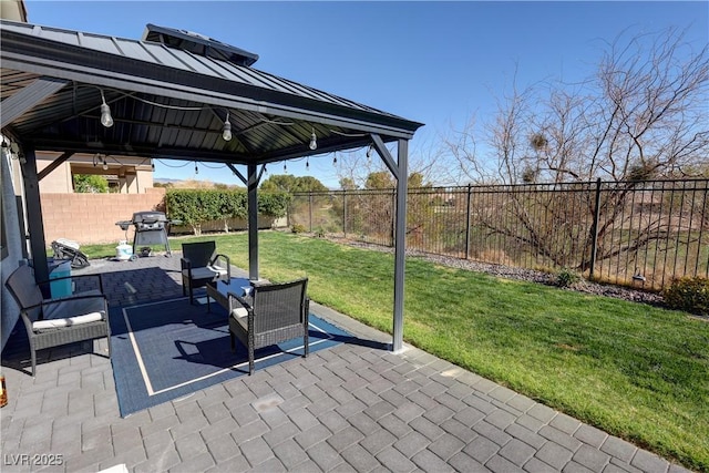 view of patio / terrace with a fenced backyard, a gazebo, and area for grilling