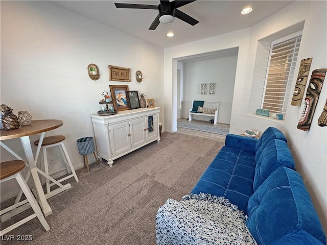 living area featuring baseboards, carpet floors, ceiling fan, and recessed lighting