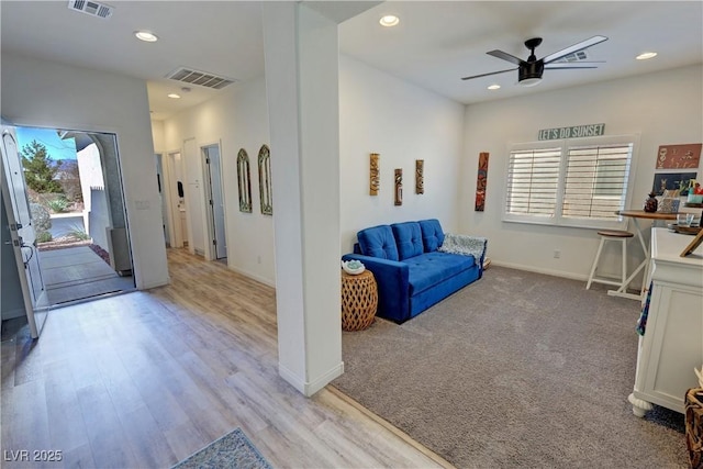 interior space featuring baseboards, ceiling fan, visible vents, and recessed lighting