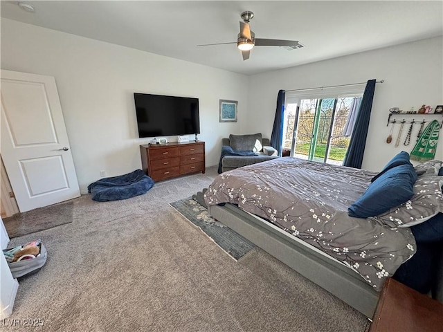 carpeted bedroom with access to exterior, ceiling fan, and visible vents