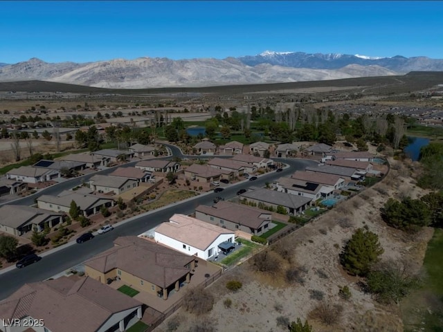 aerial view with a mountain view and a residential view