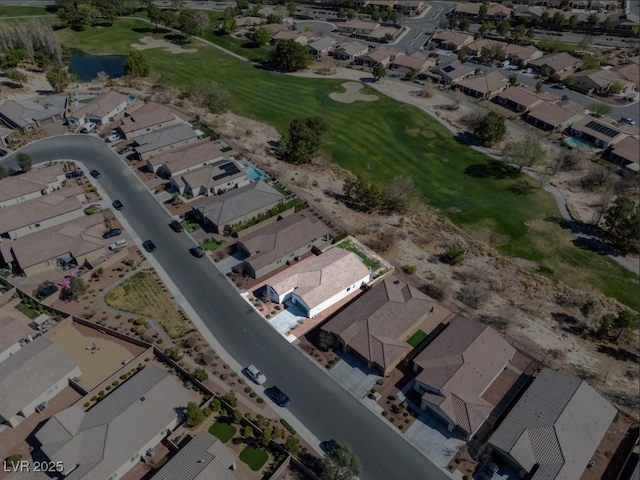 birds eye view of property with a residential view and golf course view