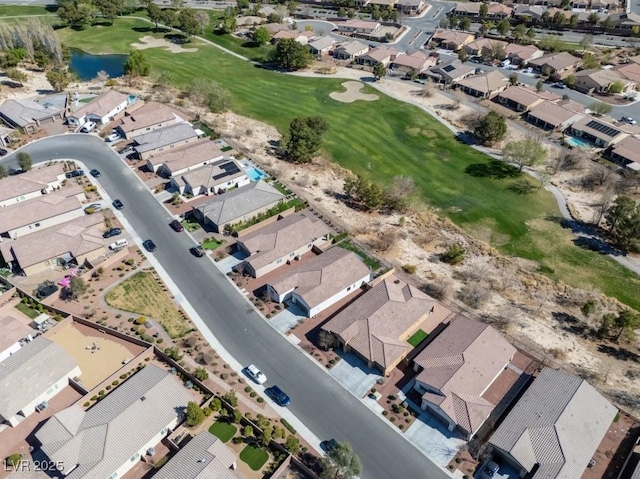 aerial view with view of golf course and a residential view