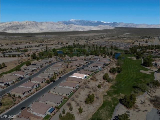 drone / aerial view with a residential view and a mountain view