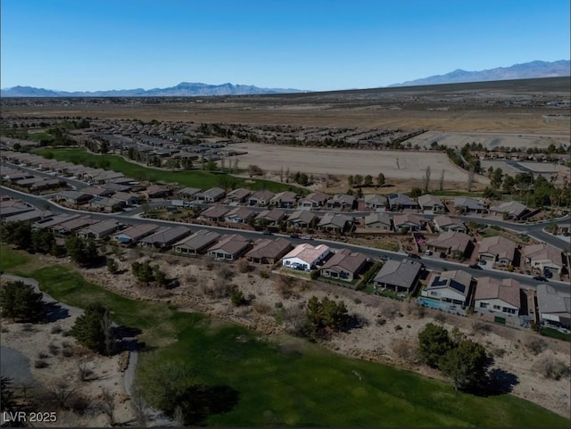 birds eye view of property with a residential view and a mountain view