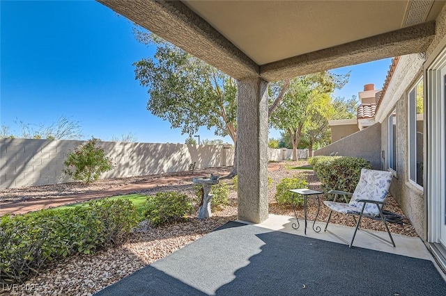 8628 Desert Holly Dr, Las Vegas, NV 89134 - view of patio / terrace featuring a fenced backyard and visible vents