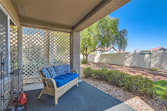 8628 Desert Holly Dr, Las Vegas, NV 89134 - view of patio / terrace featuring visible vents and fence