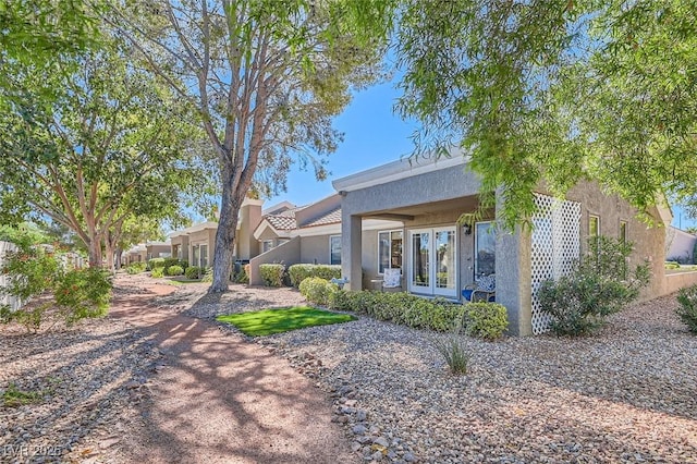 8628 Desert Holly Dr, Las Vegas, NV 89134 - view of front of property with french doors and stucco siding
