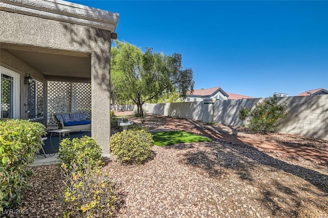8628 Desert Holly Dr, Las Vegas, NV 89134 - view of yard with a fenced backyard and a patio area