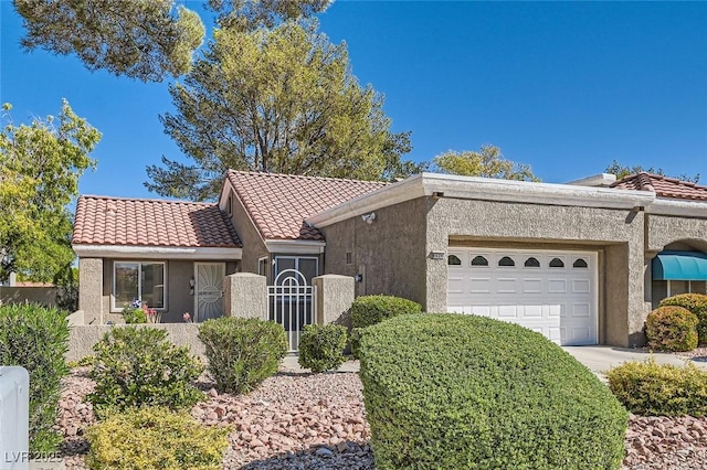 8628 Desert Holly Dr, Las Vegas, NV 89134 - view of front of house with fence, a garage, stucco siding, a tiled roof, and driveway