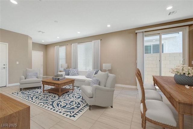 living room with recessed lighting, light tile patterned floors, visible vents, and baseboards