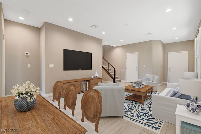 living room featuring recessed lighting, stairway, visible vents, and baseboards