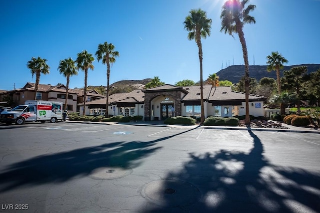 231 W Horizon Ridge Parkway Unit 314, Henderson, NV 89012 - view of building exterior featuring a mountain view and uncovered parking