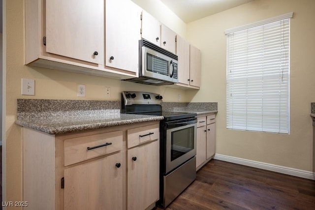 231 W Horizon Ridge Parkway Unit 314, Henderson, NV 89012 - kitchen featuring stainless steel appliances, dark wood-type flooring, baseboards, and white cabinetry