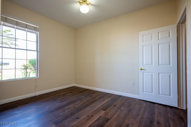 231 W Horizon Ridge Parkway Unit 314, Henderson, NV 89012 - unfurnished room with baseboards, dark wood-style floors, and healthy amount of natural light