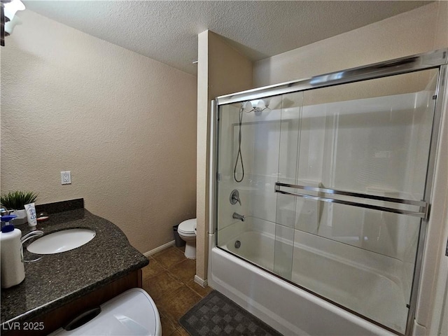 3145 E Flamingo Rd Unit 2005, Las Vegas, NV 89121 - full bath with tile patterned flooring, vanity, toilet, a textured ceiling, and enclosed tub / shower combo