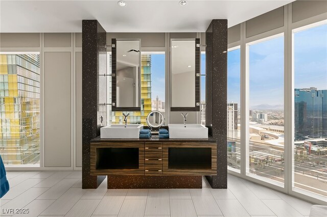 3750 Las Vegas Blvd Unit 3008, Las Vegas, NV 89158 - bathroom featuring plenty of natural light, double vanity, and a city view