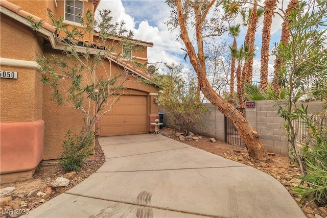 5050 Secret Rock St, Las Vegas, NV 89122 - garage featuring driveway
