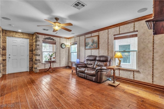 5050 Secret Rock St, Las Vegas, NV 89122 - living room with a ceiling fan, hardwood / wood-style flooring, and crown molding
