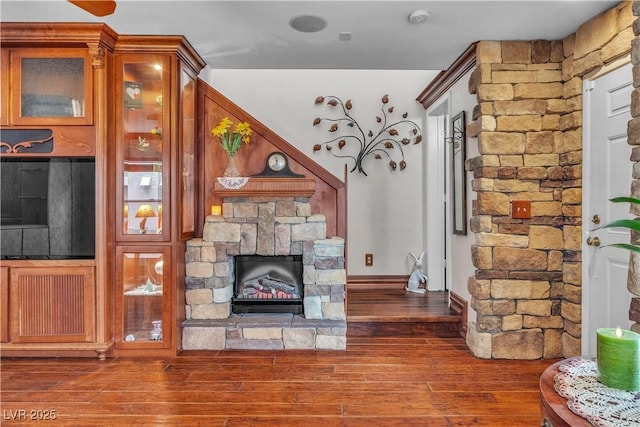 5050 Secret Rock St, Las Vegas, NV 89122 - living room with a stone fireplace and wood-type flooring