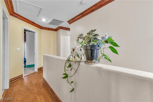 5050 Secret Rock St, Las Vegas, NV 89122 - hallway featuring crown molding, light wood-style floors, recessed lighting, and attic access