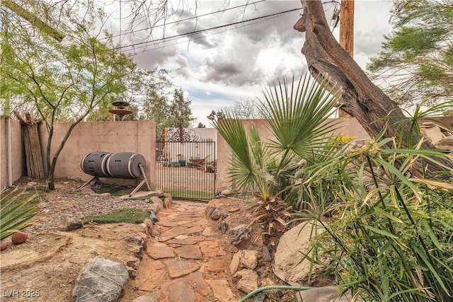 5050 Secret Rock St, Las Vegas, NV 89122 - view of yard featuring a gate