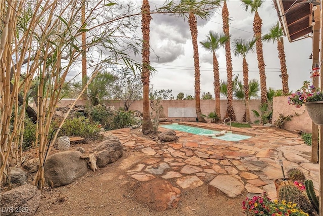 5050 Secret Rock St, Las Vegas, NV 89122 - view of swimming pool featuring a fenced backyard, a patio area, and a pool with connected hot tub