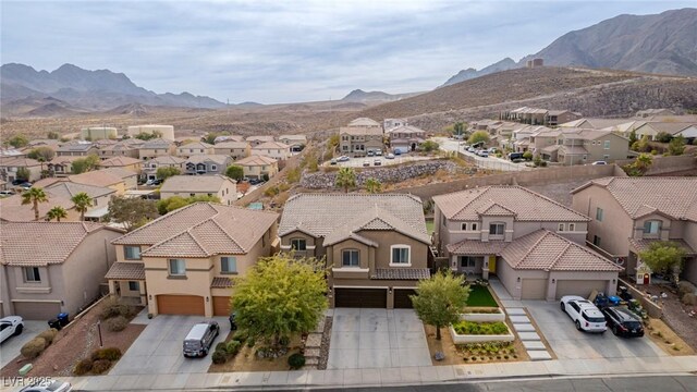 bird's eye view featuring a mountain view and a residential view