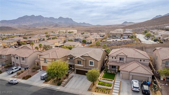 bird's eye view featuring a residential view and a mountain view