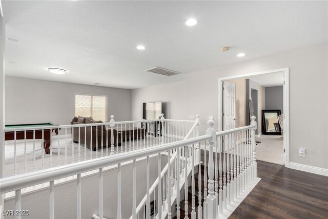 corridor featuring recessed lighting, baseboards, an upstairs landing, wood finished floors, and visible vents