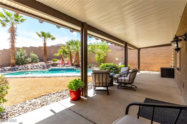 view of patio / terrace featuring a fenced in pool and a fenced backyard