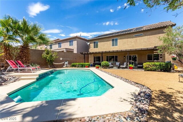 view of swimming pool with a fenced in pool, a fenced backyard, and a patio area