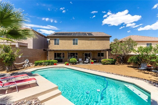 view of pool featuring a fenced in pool, a fenced backyard, and a patio area